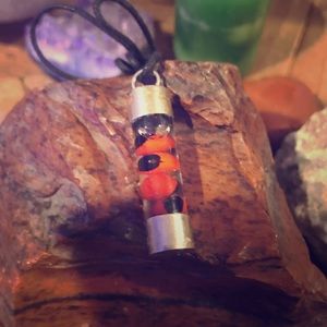 Encapsulated orange and black necklace